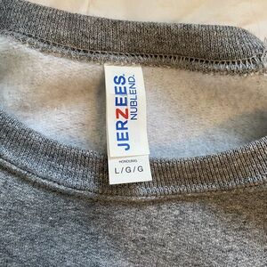 Men’s large crew neck university of Guelph dad sweater. No tags, worn once.